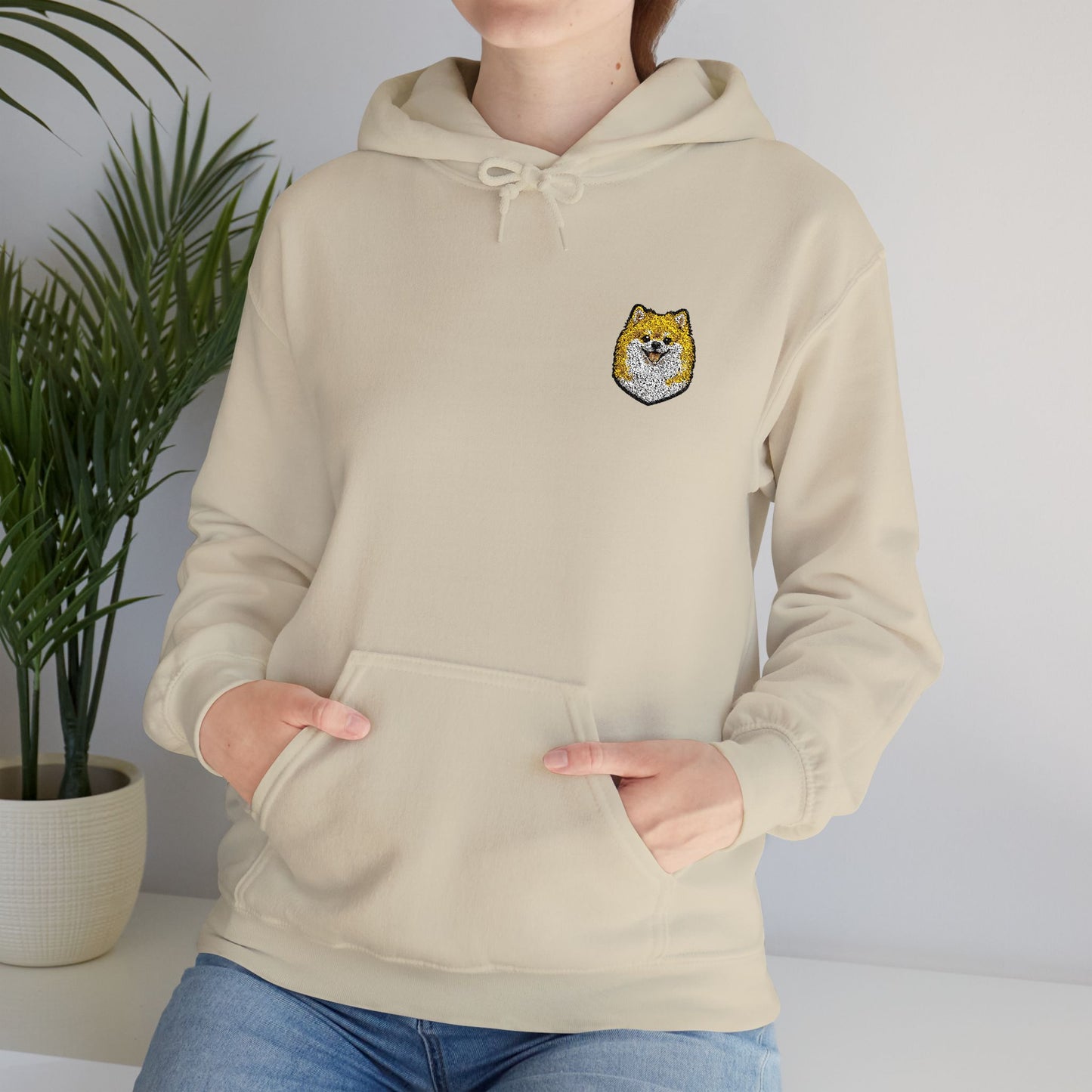 Pomeranian embroidered design on hooded sweatshirt